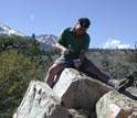 Photo of large boulders on top of glacial moraines being sampled.