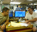 Photo of scientists Rich Camilli and Chris Reddy aboard the Endeavor in the Gulf of Mexico.