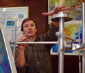 Geophysicist Eric Calais holds a geodetic marker that tracks even very small Earth movements.