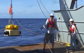 Ocean bottom seismograph deployment from the research vessel Thompson.