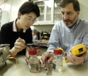 Hong Liu (left) and Bruce Logan examine an electrochemically assisted microbial reactor system