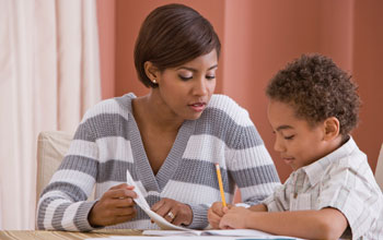 Photo of a mother teaching her child.