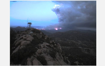 Photo of an image of a fire captured by an HPWREN automated digital camera on Lyons Peak.