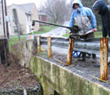 Photo of scientists Sara Geleskie and Jessica Duffy measuring stream flow.