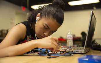 student builds a robot