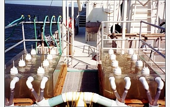 A research boat gathers seawater samples in the Gulf of Mexico to test for nutrient levels.