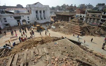 people and destroyed building in Durbar Square in Kathmandu, after the earthquake.