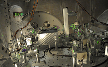 NSF LIGO specialist checks the alignment of a test beam