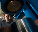 Geologist Rajdeep Dasgupta using hydraulic presses to crush rocks at high pressures.