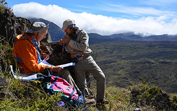 Rob Coe and Trevor Duarte orienting cores from a lava flow site