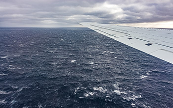 The view from a DC-8 research aircraft near where the ocean affects processes like cloud formation.