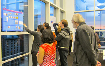People looking at a reaerch poster session