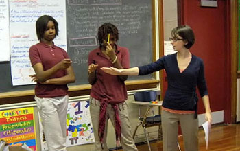 a woman, who is a fellow in Math for America, teaching math to students in a classroom.