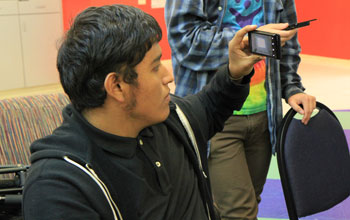 Photo of a young man creating an  app at Mobile Action Lab.