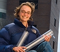 Female geologist with gear she uses for lake sediment coring.