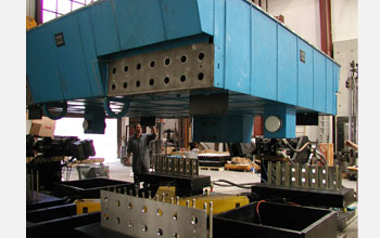 Photo of a worker helping to install the shake table at the University of Nevada, Reno.