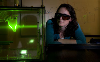 doctoral student looks into a left ventricular simulator tank.