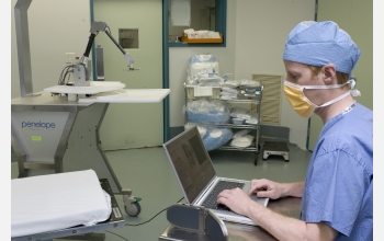 Michael Brady of Robotic Surgical Tech tests the Penelope SIS robotic arm prior to surgery.