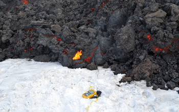 Thermal probe and datalogger (yellow) record the temperature of basaltic trachyandesite lava