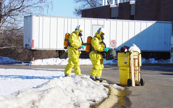 Approaching a container while handling simulated hazardous material