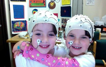 Kids wearing EEG caps.