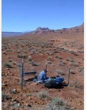 Joe Leon, a former graduate student at New Mexico Tech, is shown servicing a RISTRA seismic station.