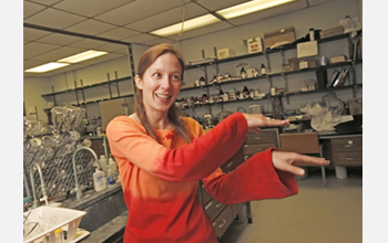 Photo of Elizabeth Harbron demonstrating the dance of conjugated polymers.