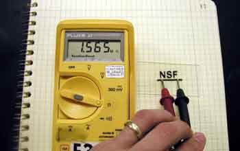 Demonstrating the conductivity of the photoprinted "NSF" image