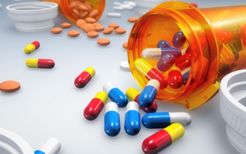 pills spilled from a prescription bottle