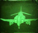 Holographic image of a F-4 fighter jet in the photo-refractive polymer screen.