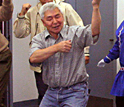 Photo of Caleb Pungowiyi dancing.