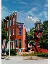 Row houses separated by an alley.