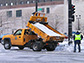 workers spreading salt from a salt truck