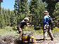 Alec Spears (left) and Troy Covill collecting seismic refraction data from geophones