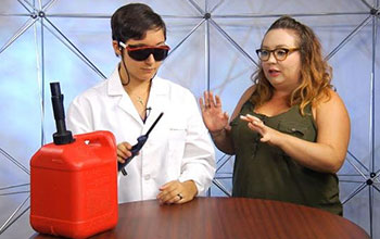 Show hosts Jordan and Charlie and gasoline canister