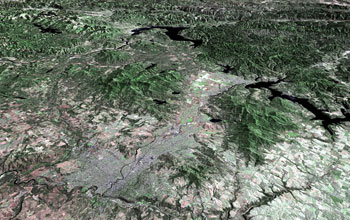 Aerial view of Spokane, WA/Coeur d'Alene, Idaho, showing mountains.