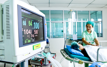 nurse and patient in hospital room