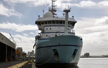 R/V Sikuliaq fueling up in a port before its research cruise in the western Pacific.