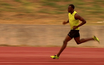 Sprinter Usain Bolt running on a track