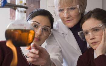 Teacher and two students in lab