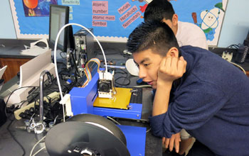student watching 3-D printer