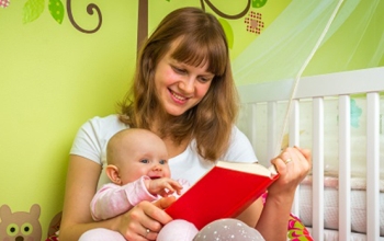 woman reading to baby