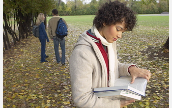 Photo of a student reading a book.