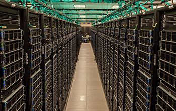 view between two rows of Frontera servers in the TACC data center