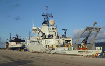 The research vessels Thompson and Langseth in port at the Guam Naval Base before the cruise began.