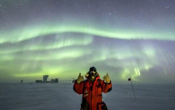 Robert Schwarz gives a thumbs up at the South Pole