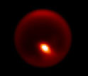 Gemini North adaptive optics image of Titan showing storm feature.