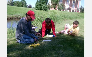 Participants from the University of North Dakota's INGEOS program take water samples