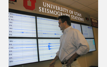 Photo of Keith Koper looking at quake evidence.