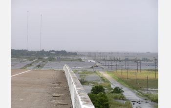 Photo of water covering part of a highway.